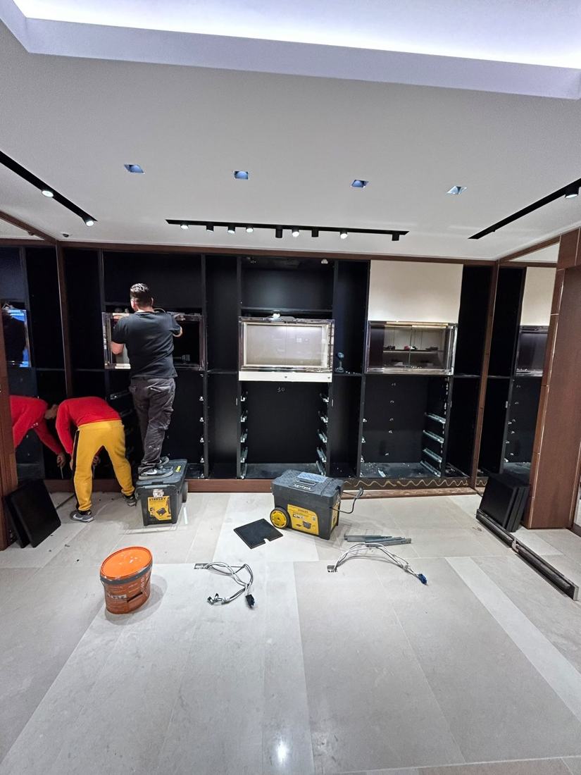 Display cabinets being installed in a store layout