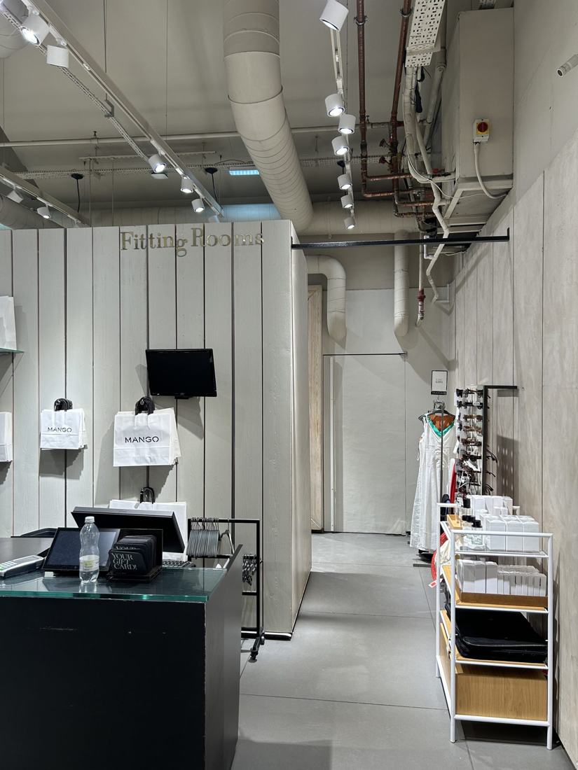 Finished fitting-room drywall and painted walls in a London fashion store